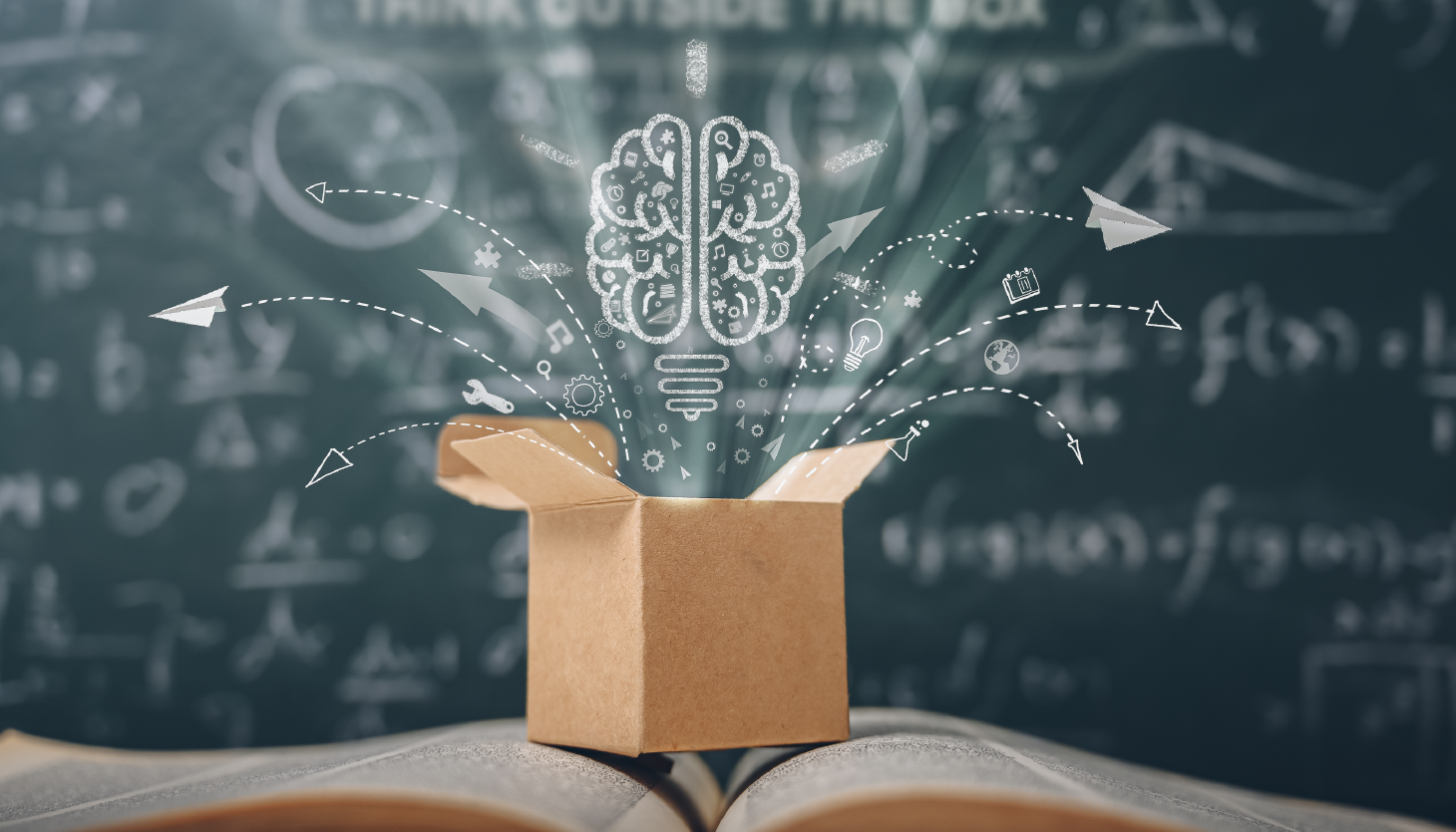 A cardboard box opening with ideas emerging from it